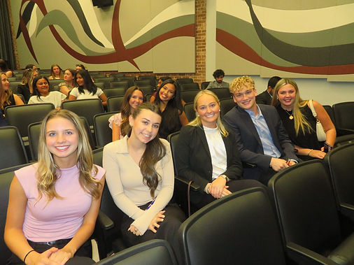 AED members seated together at a chapter meeting