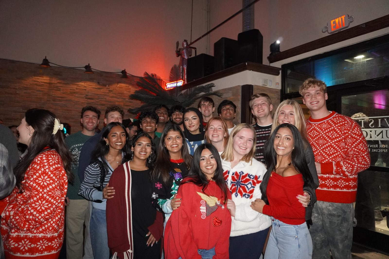 AED members at the holiday sweater social