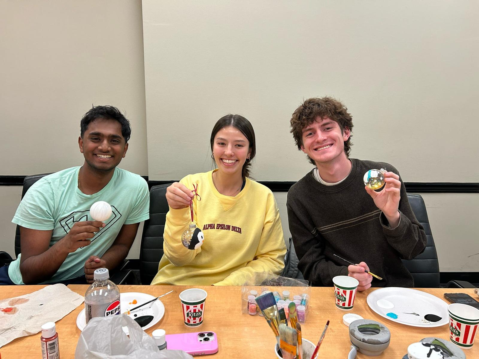 Members decorating ornaments at a chapter craft night