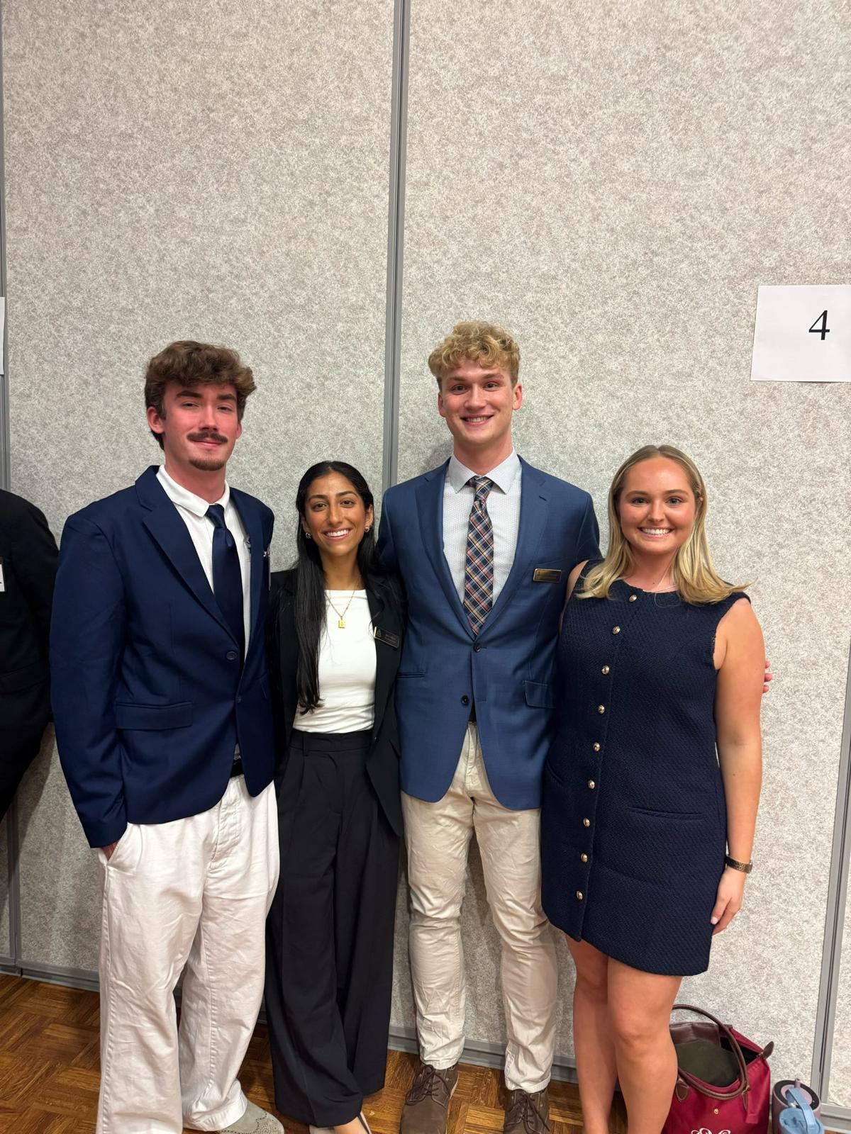 AED members in professional attire at a health professions event