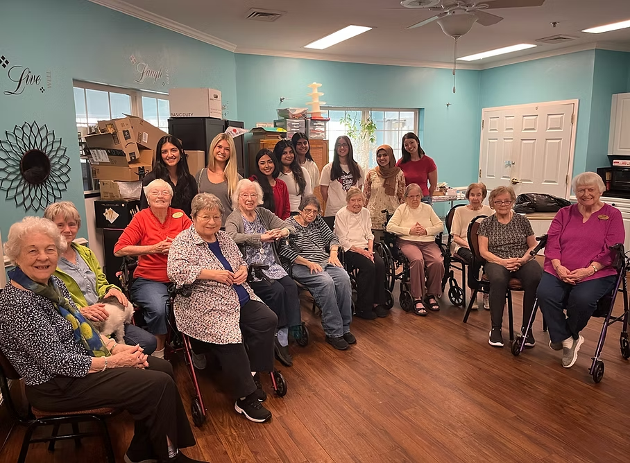 AED members with residents at a senior living community