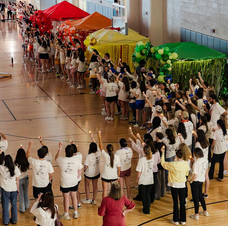 Dancers holding candles during the main event