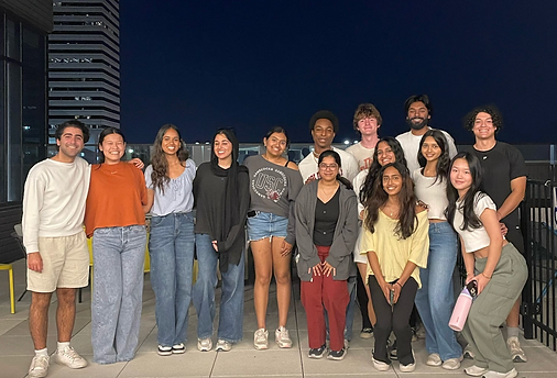 AED members together on a rooftop in the evening