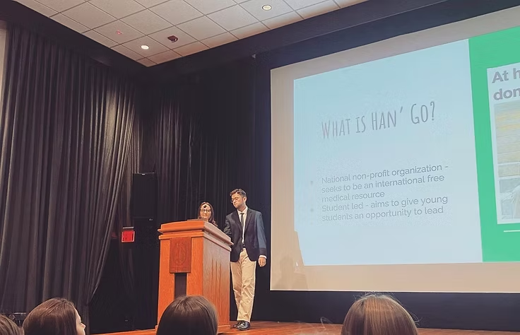 Students presenting Han' Go at an AED chapter meeting